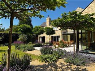 Edwardian House Cambridge

Limestone paving, Belgian bricks, formal trees and informal planting.
