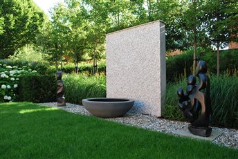 Secluded contemporary retreat - feature wall with water bowl, flanked by clients statuary.