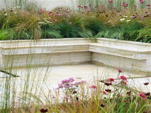 Beautiful natural stone has been cut to create bespoke built in seating in this Gold medal winning RHS show garden.