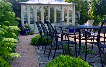 Informal dining area with reclaimed paving