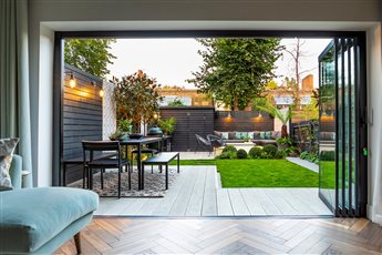 Dulwich multi use family garden. Dining area, lounge seating , firepit and outdoor kitchen