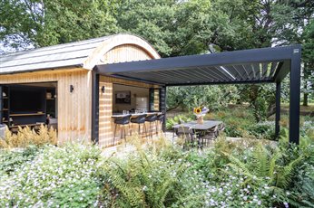 Garden Design and Build by Cube 1994, bespoke garden room with pergola dining area and bifold bar windows 
