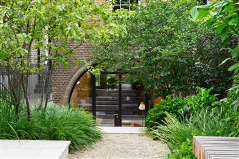 This garden in South London has one of the most exciting entrances we have ever designed - this staircase takes the visitor up from the lower ground floor to the garden itself in the most dramatic way.