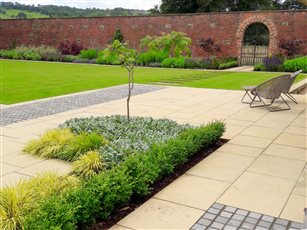 Large walled garden with terrace area in Yorkshire.