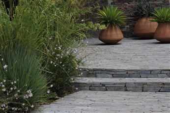 Stone steps and hand-built clay pots at Ollie House in Meru County, Kenya